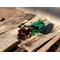 A sunlit sachet of Nana's Apple Pie potpourri by Irish Twins Potpourri sits on an old pallet with a wooden fence blurred in the background.